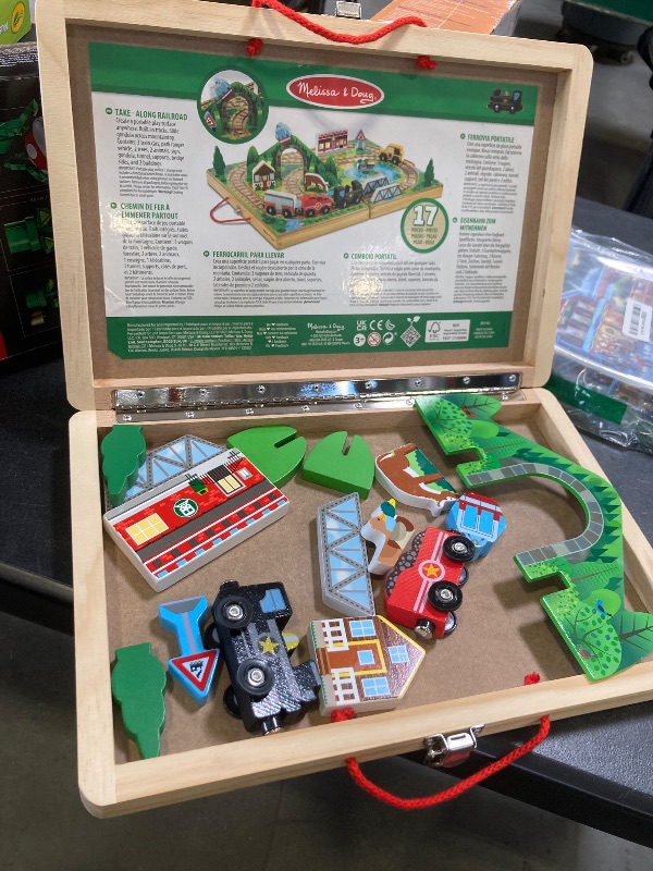 Photo 1 of Melissa & Doug 17-Piece Wooden Take-Along Tabletop Railroad, 3 Trains, Truck, Play Pieces, Bridge