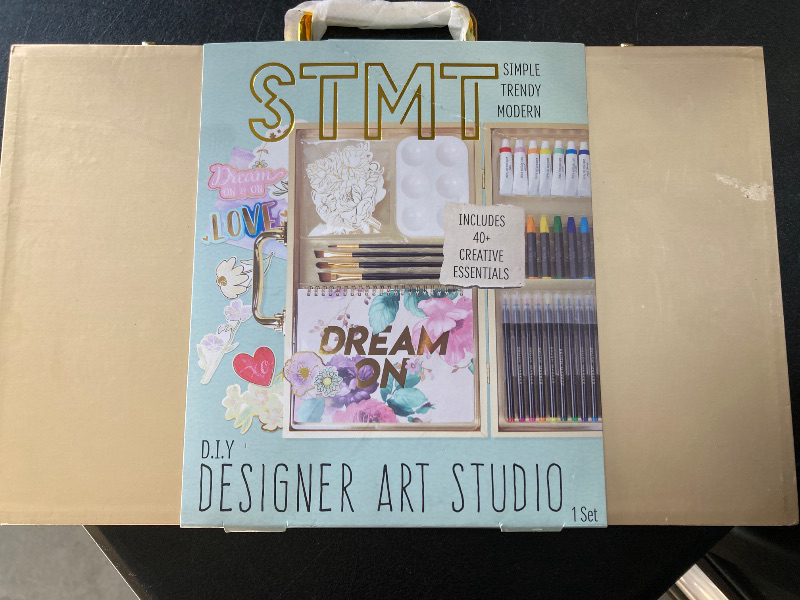 Photo 1 of STMT DIY Designer Art Studio by Horizon Group USA, Kit Includes 40+ Art Making Essentials, Water Colors, Oil Pastels, Brush Markers, Spiral Art Pad & More, Gold