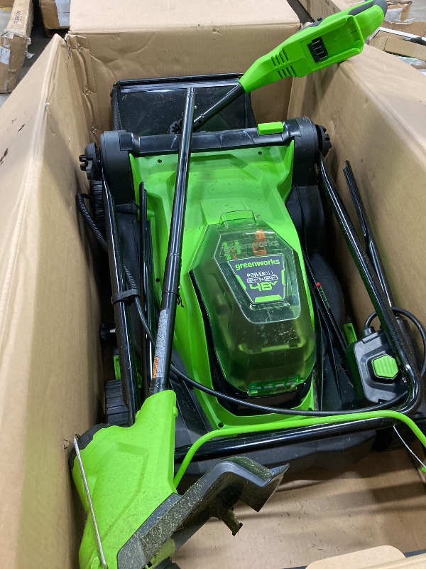Photo 1 of ***(ITEM AS SHOWN IN BOX, USED, MISSING PIECES, DIRTY/GRASS RESIDUE ON EQUIPMENT, SOME SCUFFS/SCRATCHES, NOT TESTED)*** 

Greenworks 48V (2x24V) 17" Brushless Mower+12" String Trimmer +320CFM (2) 4.0Ah 