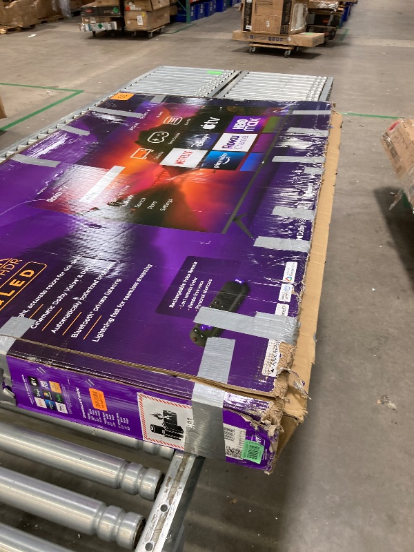 Photo 1 of **PARTS ONLY/BROKEN SCREEN**Roku Smart TV – 65-Inch Plus Series 4K QLED RokuTV with Roku Voice Remote Pro, Dolby Vision, Striking 4K Resolution, Automatic Brightness, & Seamless Streaming – Live Local News & Sports