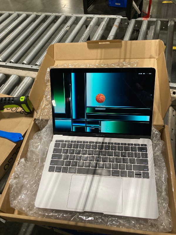 Photo 1 of Apple MacBook Air MVFK2LLA, 13 Inches 1.6GHz dual-core Intel Core i5, 8GB RAM, 128GB - Silver (Renewed)*** The screen has vertical lines more likely on the left side of the screen ***