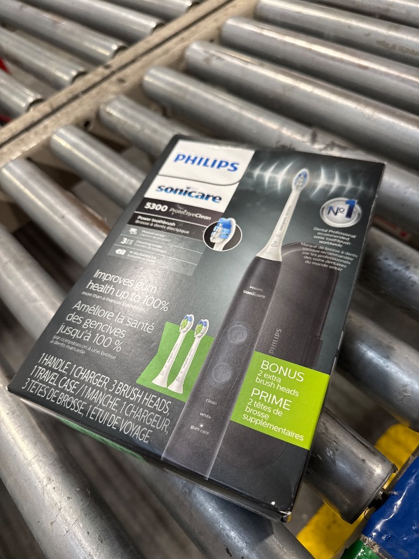Photo 1 of Philips Sonicare ProtectiveClean 5300 Rechargeable Electric Toothbrush, with Pressure Sensor, 3 Cleaning Modes, SmarTimer and QuadPacer, with 2 Bonus Brush Heads, Travel Case, Black, Model HX6423/34
