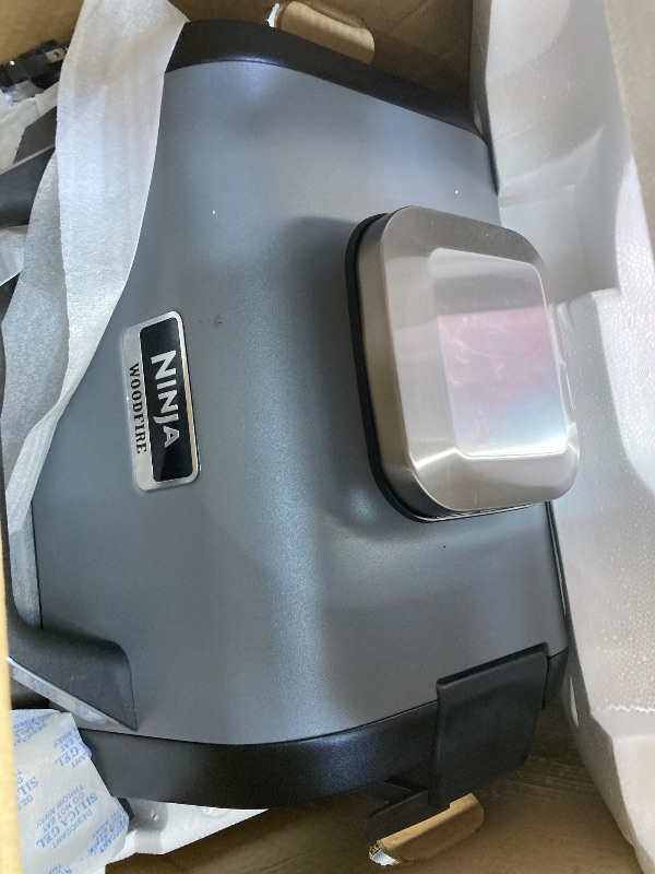 Photo 1 of ***USED****Ninja OG751 Woodfire Pro Outdoor Grill Built-In Thermometer,7-in-1 Master Grill,BBQ Smoker,& Outdoor Air Fryer Plus Bake,Roast,Dehydrate & Broil,Woodfire Technology,Weather-Resistant,Grey XL