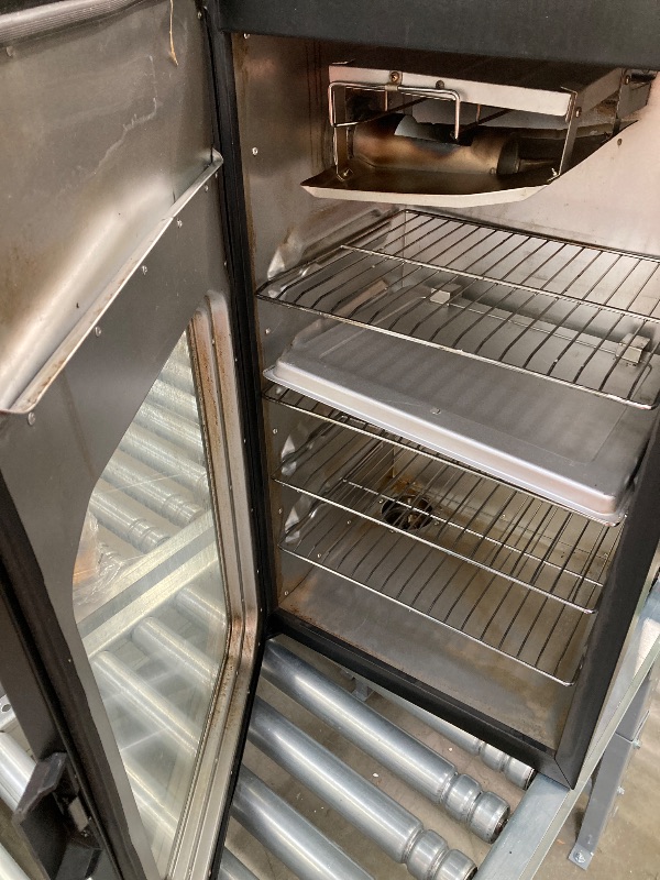 Photo 1 of ***(PARTS ONLY -SELLING AS PARTS ONLY)*** BOX RIPPED/TORN*** 
Masterbuilt® 30-inch Digital Electric Vertical BBQ Smoker with Leg Kit, Side Wood Chip Loader and 710 Cooking Square Inches in Black, Model MB20070421