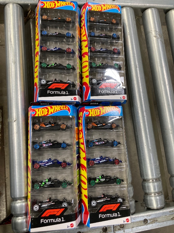 Photo 1 of **4 Pack Bundle**
Hot Wheels Toy Cars Formula 1, 4-Pack Bundle, Set of 5 Cars 1:64 Scale Die-Cast Vehicles Featuring F1 Racing Team Decos, Collectible Race Cars