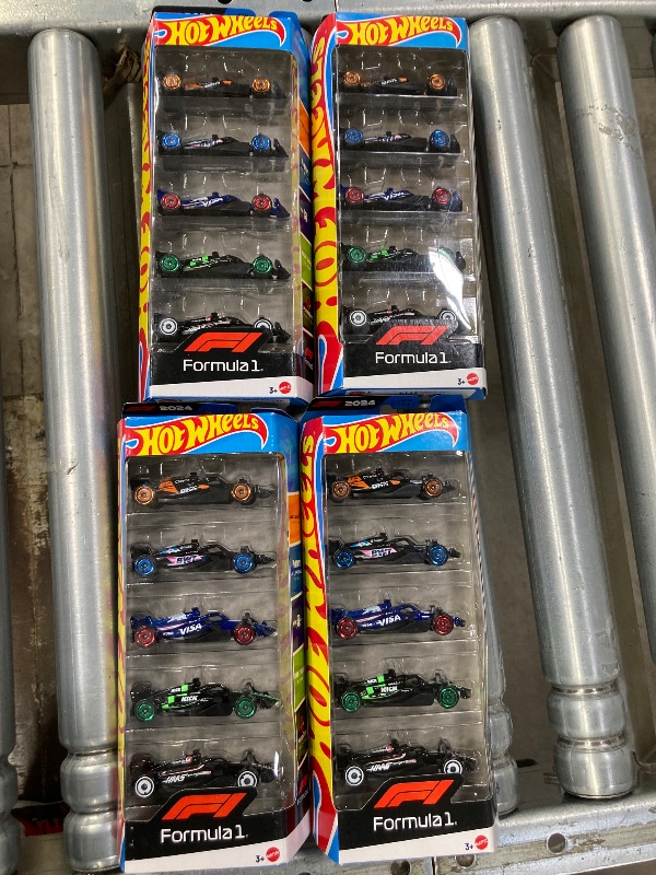 Photo 1 of **4 Pack Bundle**
Hot Wheels Toy Cars Formula; 4-Pack Combo; Set of 5 Cars; 1:64 Scale Die-Cast Vehicles Featuring F1 Racing Team Decos, Collectible Race Cars