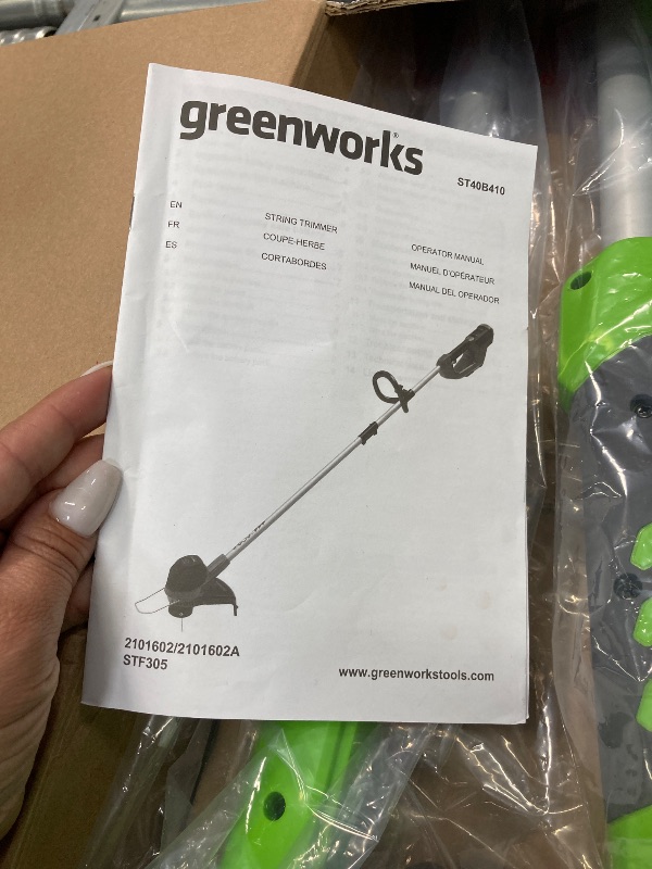 Photo 1 of ***(PARTS ONLY -SELLING AS PARTS ONLY)***
Greenworks 40V 12" String Trimmer with 2.0 Ah Battery & Charger 2101602 ***(BOX RIPPED/TORN)***