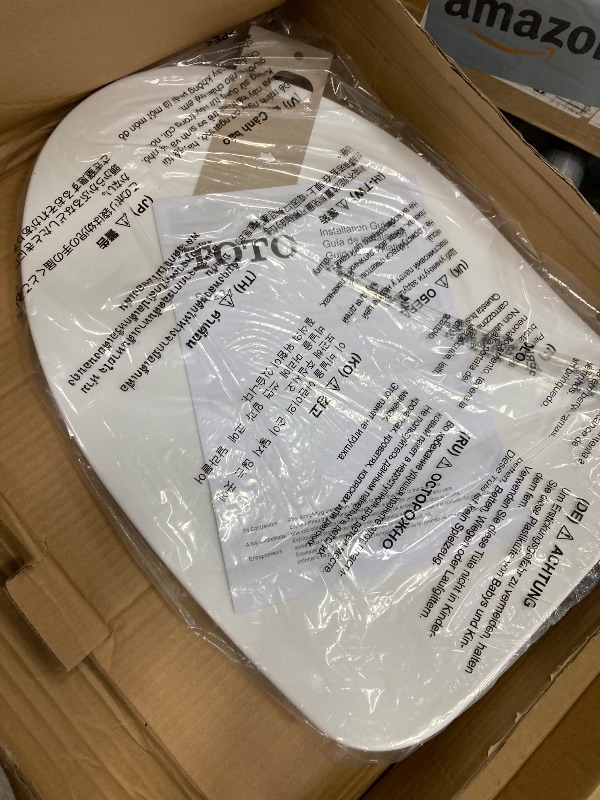 Photo 1 of **MISSING HARDWARE AND SILVER SEAT HOLDERS**TOTO® SoftClose® Ultra Slim, Toilet Seat and Lid, Cotton White - SS234#01