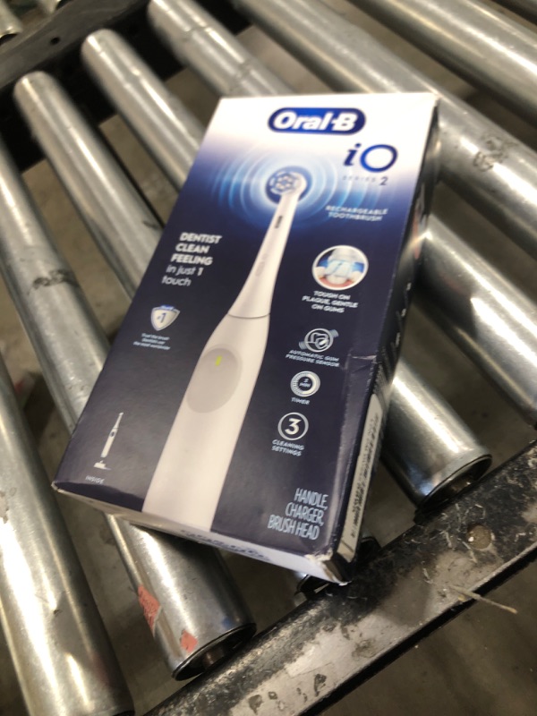 Photo 1 of Oral-B iO Series 2 Rechargeable Electric Powered Toothbrush, Pure White with 1 Gentle Care Brush Head - Automatic Pressure Sensor to Protect Gums - 3 Modes - 2 Min Timer