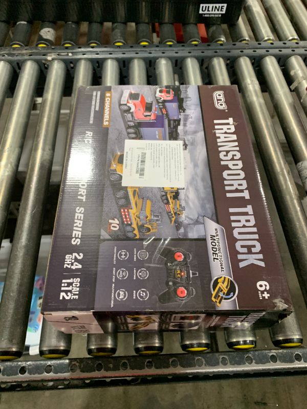 Photo 1 of Remote Control Semi Truck with Trailer - 23.6 Inch 9-Channel RC Semi Truck Toy for Kids, 1:24 Container Truck with 2 Batteries, Van Transport Vehicle with Lights & Music, Great Gift for Boys Girls