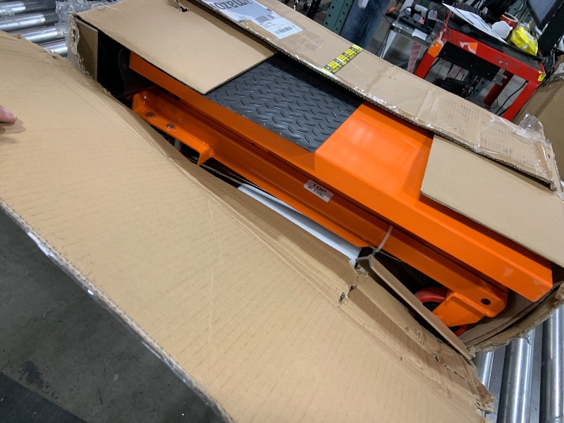 Photo 1 of VEVOR Hydraulic Lift Table Cart, 330lbs Load Capacity 50 Inch Lifting Height, Manual Single Scissor Lift Table with Non-Slip Pad and 4 Wheels, Hydraulic Scissor Cart for Material Handling, Orange