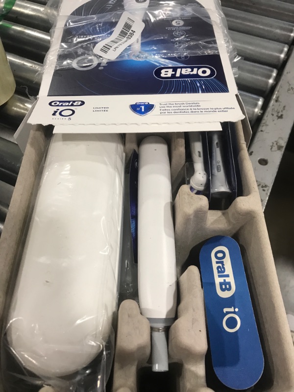 Photo 1 of Oral-B iO Deep Clean + Whiten Rechargeable Electric Toothbrush with Visible Pressure Sensor, 2 Minute Timer, 5 Cleaning Settings, 1 iO5 Limited, 3 Toothbrush Heads, Travel Case & Refill Holder, White