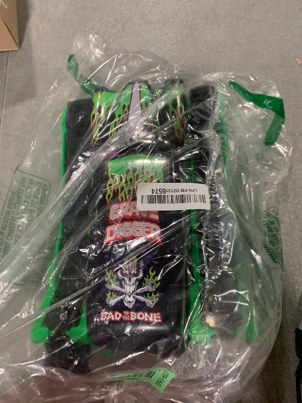Photo 1 of Monster Jam, Official Grave Digger Trax All-Terrain Remote Control Outdoor Vehicle, 1:15 Scale, Kids Toys for Boys and Girls Ages 4 and Up
