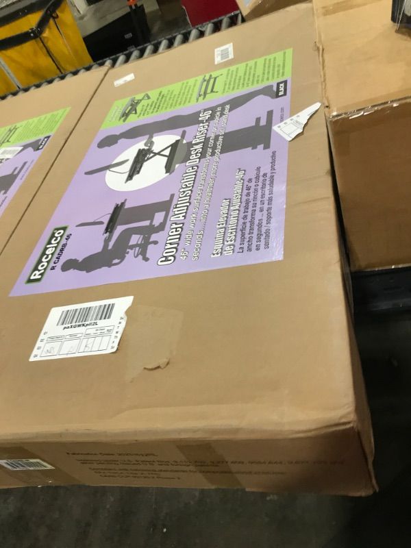 Photo 1 of Rocelco 46" Height Adjustable Corner Standing Desk Converter - Quick Sit Stand Up Dual Monitor Riser - Gas Spring Assist Tabletop Computer Workstation - Large Keyboard Tray - Black (R CADRB-46)