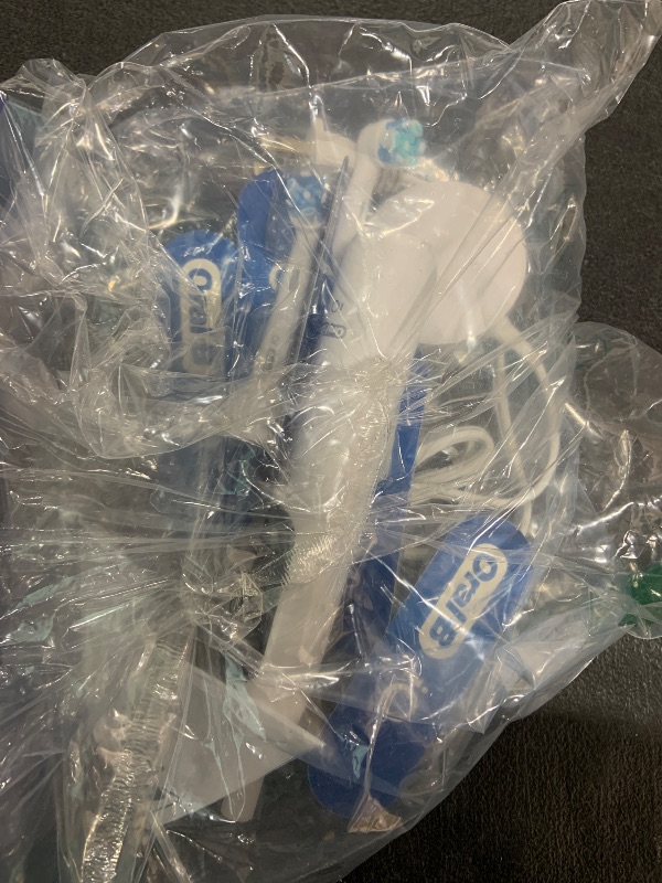 Photo 1 of Oral-B iO Deep Clean + Protect Rechargeable Electric Toothbrush, White with a iO Series 7 Toothbrush, 2 Replacement Brush Heads, and a Charging Travel Case