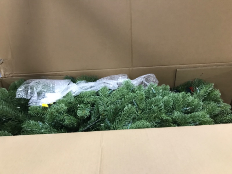 Photo 1 of National Tree Company Pre-Lit 'Feel Real' Artificial Full Downswept Christmas Tree, Green, Douglas Fir, White Lights, Includes Stand, 6.5 feet