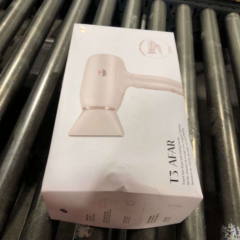 Photo 1 of T3 Afar Lightweight Travel-Size Hair Dryer with Auto Dual Voltage, Folding Handle, Fast Drying, Lightweight and Ergonomic, Frizz Smoothing, Multiple Heat and Speed Combinations