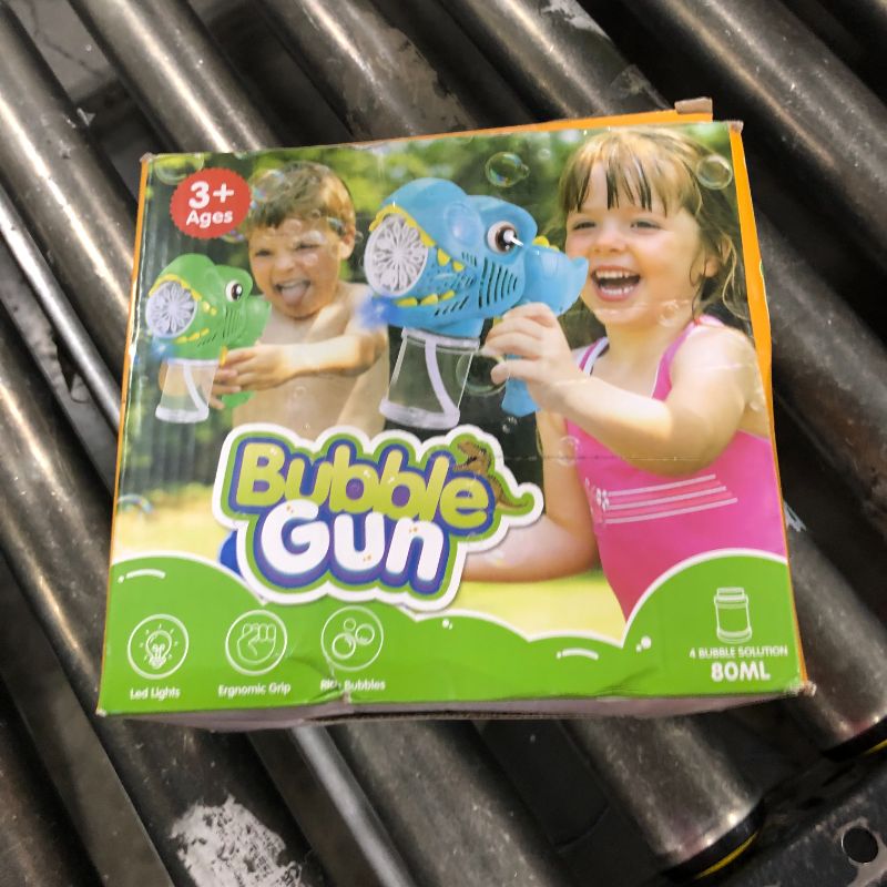 Photo 1 of Kids Bubble  2 Pack Dino Bubble Machine Gun for Toddlers with 4 Solutions Automatic 13-Hole Bubbles for Kids Blower Maker Easter Basket Essentials Stocking Stuffers Gift Party Favors for Boys Girls