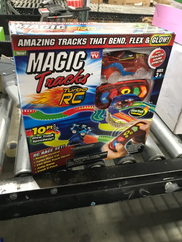 Photo 1 of Ontel Magic Tracks RC - Remote Control Turbo Race Cars & 10 ft of Flexible, Bendable Glow in the Dark Racetrack - As Seen on TV, Color may Vary