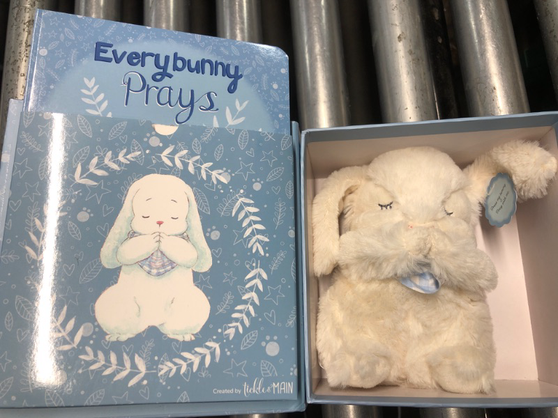 Photo 1 of **BUNNY DOESN'T MAKE NOISE** Tickle & Main Everybunny Prays - The Praying Musical Toy - Baptism & Christening Gifts for Boys, Babies & Toddlers on Easter & Christening (Blue, 7 in) - Baptism Gifts for Girl - Bunny Stuffed Animal