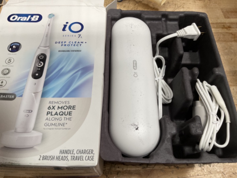 Photo 1 of Oral-B iO Deep Clean + Protect Rechargeable Electric Toothbrush, White with a iO Series 7 Toothbrush, 2 Replacement Brush Heads, and a Charging Travel Case