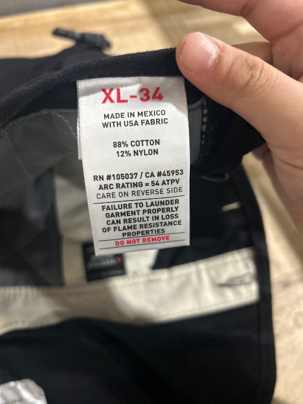 Photo 1 of (See all images)Ariat Men's Flame Resistant Insulated Bib 2.0Coveralls, black, XL 34