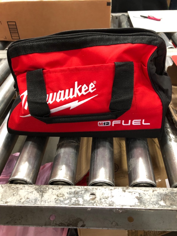 Photo 1 of -Milwaukee Heavy Duty (FUEL Tool Bag). Fits (1-2 Tool Kit) 2760-20, 2866-22, 2866-20, Fuel Screwgun and other Cordless Tools alike
-Milwaukee Genuine OEM 48-59-2401 M12 Lithium Ion 12 Volt Battery Charger w/LED Indicating, Red
-Milwaukee 48-11-2440 M12 RE