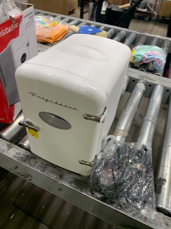 Photo 1 of Frigidaire EFMIS129-WHITE, Mini Portable Fridge, 4 Litres Capacity, Chills Six 12oz Cans, 100% Freon-Free & Eco Friendly, Beverage Cooler- White
