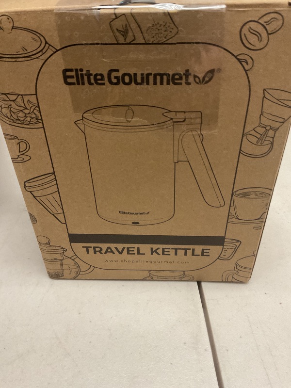 Photo 1 of Elite Gourmet EKT719 Dual Volt 120-230V, Travel Double Wall Insulated Cool-Touch, 0.6L Electric Kettle, Stainless Steel Interior, Hinged-Locking Lid, Retractable Handle, Auto Shut-Off, Boil Dry, Black