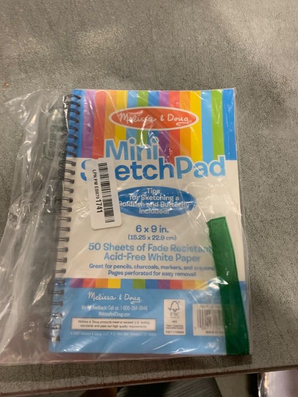 Photo 1 of Melissa & Doug Mini Sketch Pad - 50 Spiral-Bound Blank White Pages, 6 Inches x 9 Inches