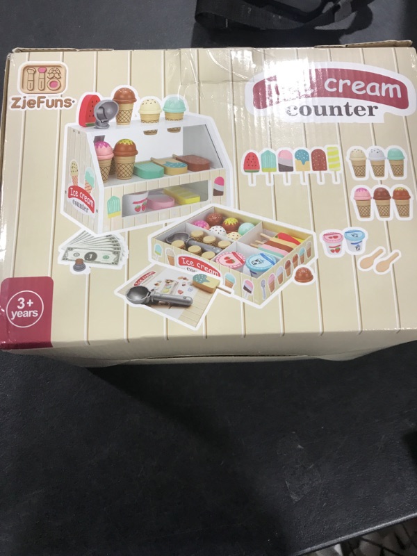 Photo 1 of ZJEFUNS Wooden Ice Cream Toys for Kids Ice Cream Counter Shop for Toddlers Pretend Play Food Scoop and Serve with Scoop & Menu & Fake Money for Boys and Girls Ages 3 4 5 6.