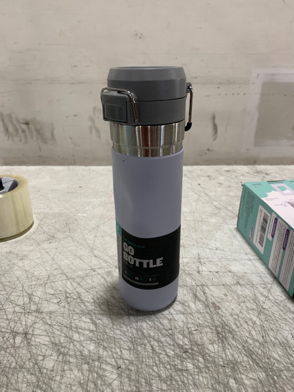 Photo 1 of Stanley Quick Flip GO Water Bottle 24 oz | Push Button Lid | Leakproof and Packable for Travel and Sports | Insulated Stainless Steel | BPA-Free | Lilac