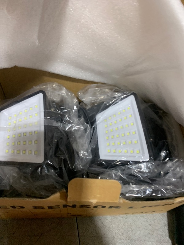 Photo 1 of LYWALT Solar Outdoor Lights - 3000LM 188 LED Motion Sensor Outdoor Lights, 4 Heads Security Light,IP65 Waterproof, Easy Install,270°Wide Angle Flood Wall Light with 3 Modes for Backyard Yard (2 Pack)