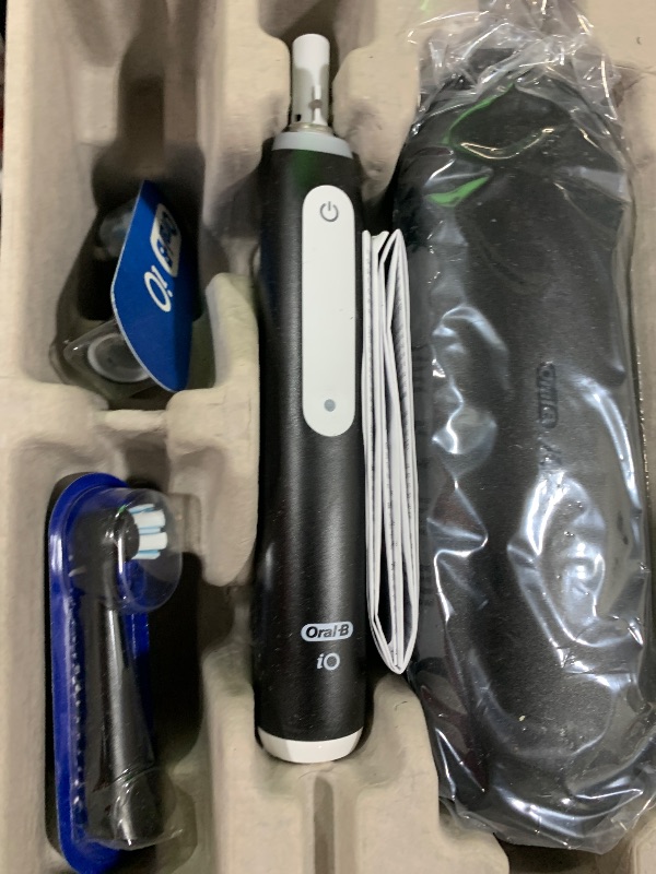 Photo 1 of Oral-B iO Deep Clean Rechargeable Electric Powered Toothbrush, Black with iO Series 3 Limited, 2 Brush Heads and Travel Case - Pressure Sensor to Protect Gums - 3 Cleaning Settings - 2 Minute Timer