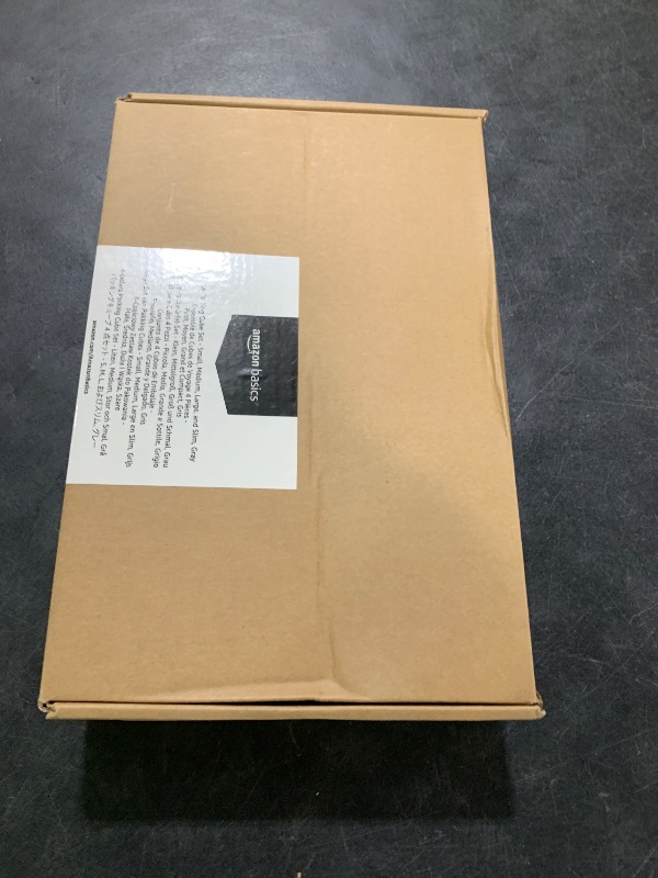 Photo 1 of Amazon Basics Lightweight Packing Cubes Travel Organizer Set with Double Zipper, Mesh Top, Multiple Sizes, 4 Piece, Gray