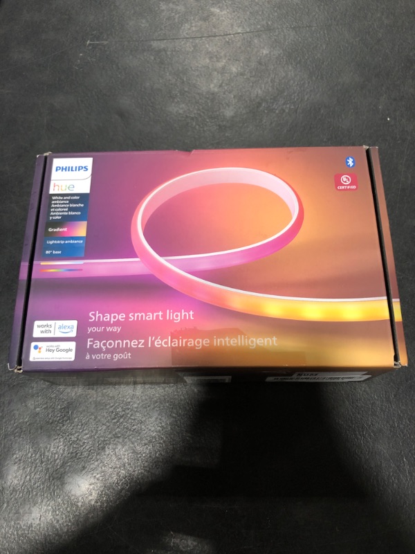 Photo 1 of Philips Hue Indoor 6-Foot Smart LED Light Strip Base Kit with Plug - Flowing Multicolor Effect - 1 Pack - Control with Hue App - Works with Alexa, Google Assistant and Apple HomeKit