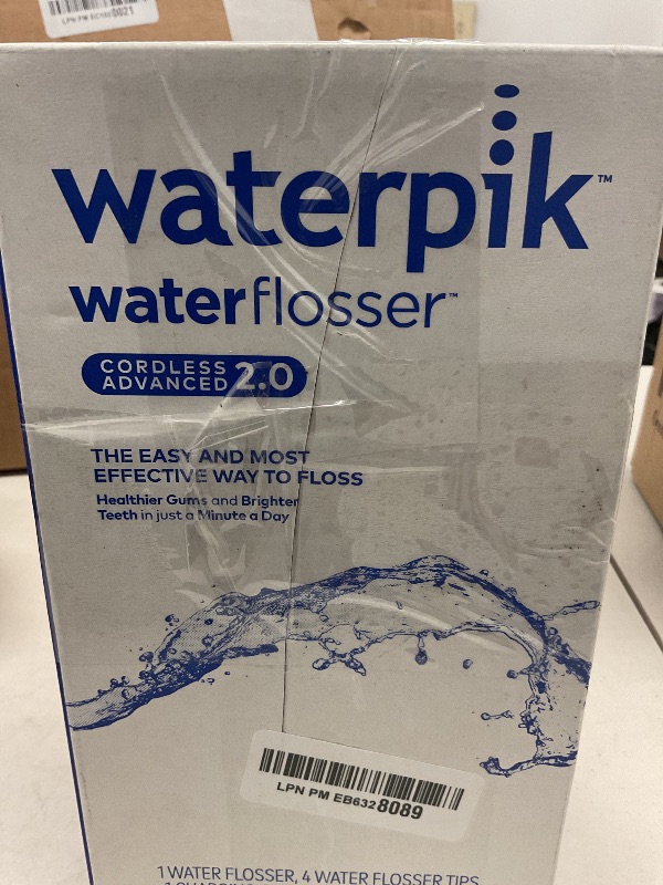Photo 1 of Waterpik Cordless Advanced 2.0 Water Flosser For Teeth, Gums, Braces, Dental Care With Travel Bag and 4 Tips, ADA Accepted, Rechargeable, Portable, and Waterproof, Blue WP-583, Packaging May Vary