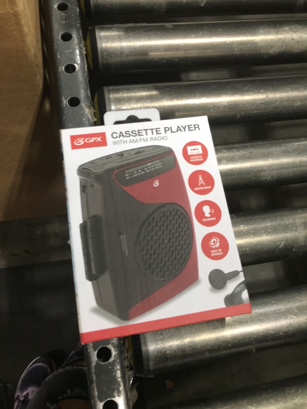 Photo 1 of GPX Portable Cassette Player, Compatible With Headphone, 3.54 x 1.57 x 4.72 Inches, Requires 2 AA Batteries - Not Included, Red/Black (CAS337B) Black/Red