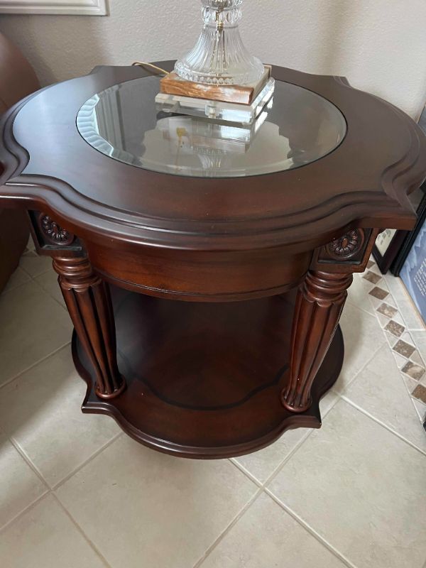 Photo 1 of MAHONGANY COLOR WOODEN AND GLASS END TABLE. 24”H PART OF SET OF 2 (SOLD SEPARATELY)