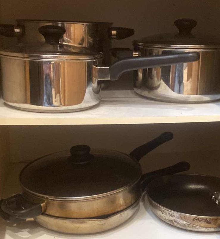 Photo 1 of CONTENTS OF CABINET- ULTREX POTS & PANS 8 PC SET