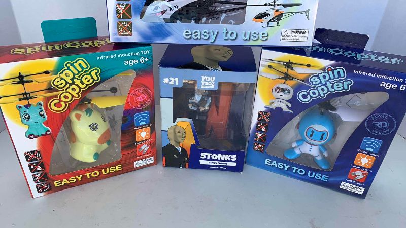 Photo 1 of TOY COPTERS AND A STONKS FIGURE