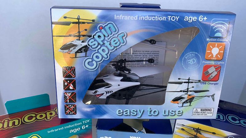 Photo 1 of TOY COPTERS AND A STONKS FIGURE
