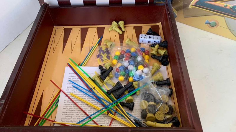 Photo 1 of TWENTIETH ANNIVERSARY TRIVIAL PURSUIT GAME AND MULTI GAME SET