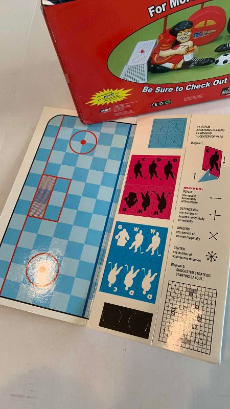 Photo 1 of NHL R/C HOCKEY GAME AND A STRATEGY BOARD GAME
