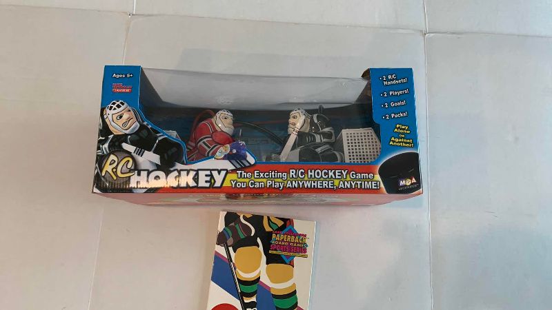 Photo 1 of NHL R/C HOCKEY GAME AND A STRATEGY BOARD GAME
