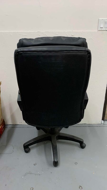 Photo 1 of FAUX LEATHER HIBACK OFFICE CHAIR WITH ROLLERS
