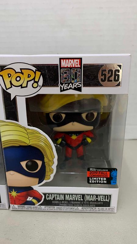 Photo 1 of FUNKO POP MARVEL EL VENENOIDE 707, AND CAPTAIN MAVEL (MAR-VELL) #526