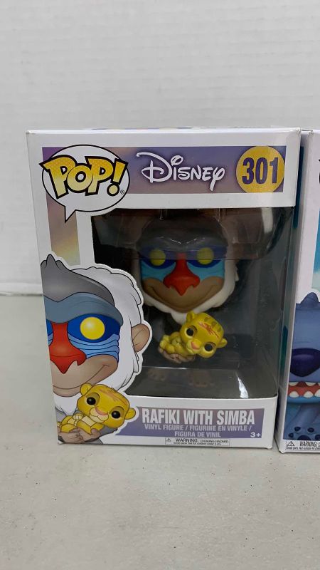 Photo 1 of FUNKO POP DISNEY STITCH 1045 AND RAFIKI WITH SIMBA 301