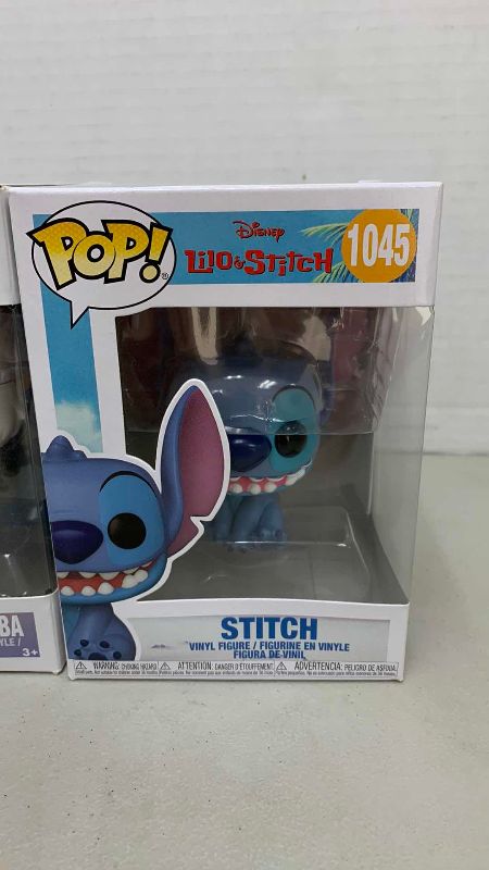Photo 1 of FUNKO POP DISNEY STITCH 1045 AND RAFIKI WITH SIMBA 301