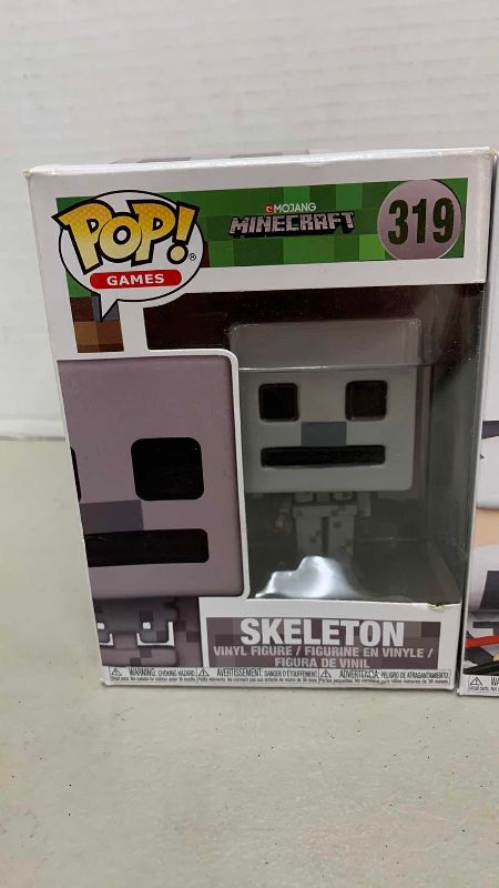 Photo 1 of FUNKO POP MINECRAFT SKELETON 319 AND G.I. JOE STORM SHADOW 77